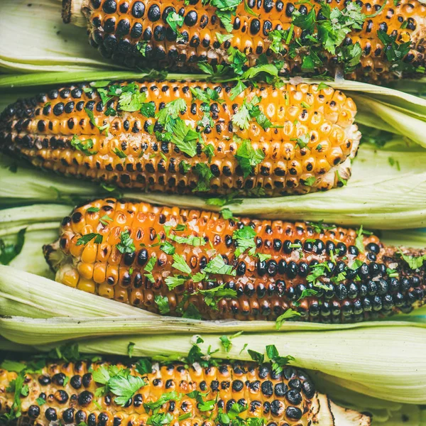 Summer vegan dinner or snack. Grilled sweet corn with smoked sea salt and cilantro
