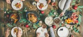 Картина, постер, плакат, фотообои "traditional christmas, new year holiday celebration. flat-lay of friends or family and cat eating at festive table with turkey or chicken, vegetables, mushroom sauce, fruit, top view, wide composition", артикул 232045142