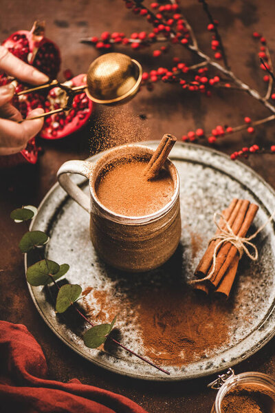 Turkish Traditional Wintertime Hot Drink Salep Human Hand Pouring Cinnamon Royalty Free Stock Photos