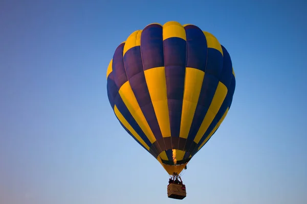 Big balloon flies against the sky