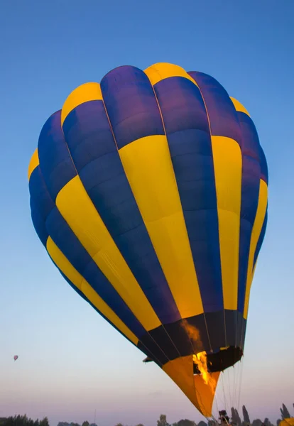 Big balloon flies against the sky