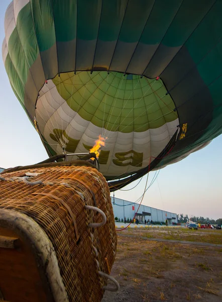 Green balloon takes off from the ground