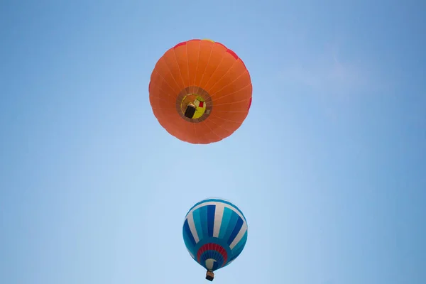 Big balloon flies against the sky