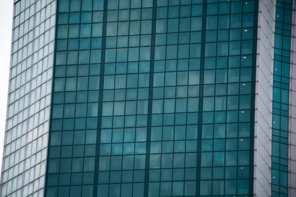 Glass windows of an office building in a modern city in the financial district