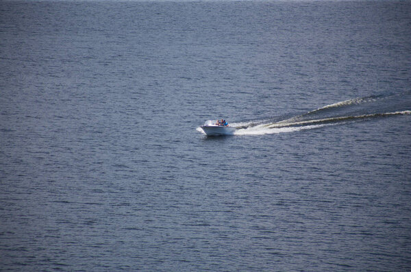 Kyiv, Ukraine 09.15.2020: The motor boat sails along the river