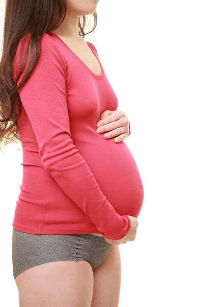 Vrouw Aanraken Van Haar Groeiende Zwangere Buik — Stockfoto