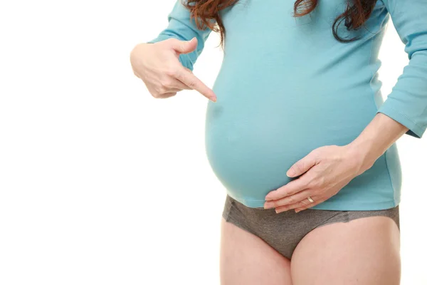 Kobieta Ciąży Wskazująca Żołądek — Zdjęcie stockowe