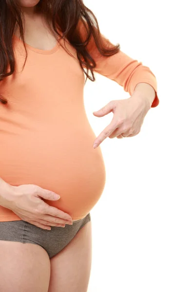 Mulher Grávida Apontando Para Estômago — Fotografia de Stock