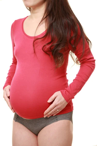Kobieta Dotykając Jej Rosnący Brzuch Ciąży — Zdjęcie stockowe