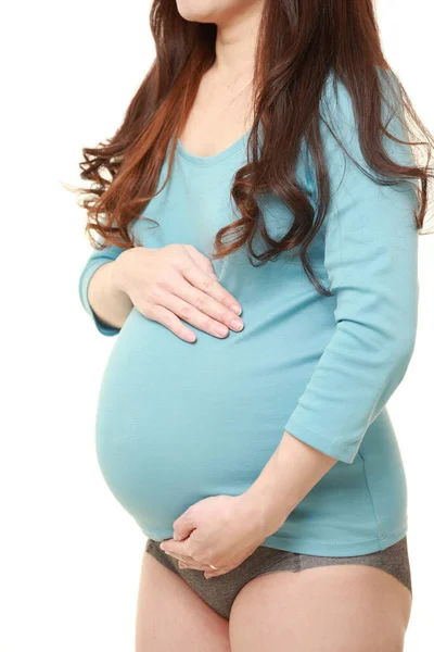 Žena Dotýká Její Rostoucí Těhotné Břicho — Stock fotografie