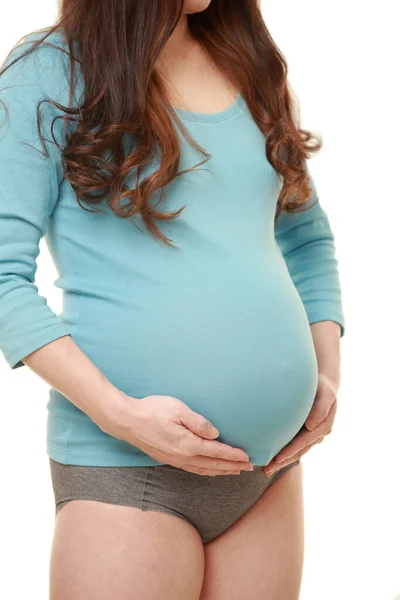 Kobieta Dotykając Jej Rosnący Brzuch Ciąży — Zdjęcie stockowe