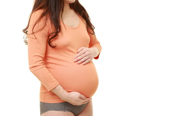 Γυναίκα Που Αγγίζει Την Κοιλιά Της Μεγαλώνει Έγκυος — Φωτογραφία Αρχείου