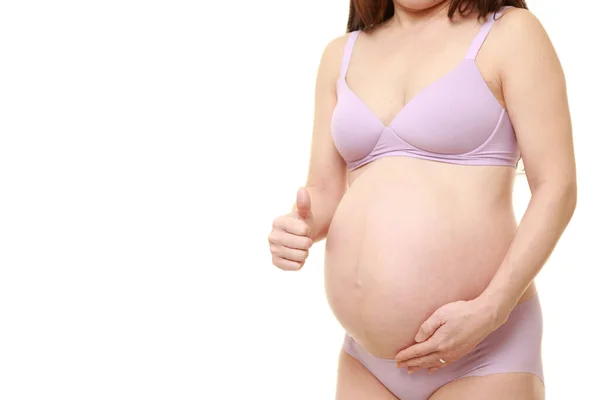 Başparmakları Havada Hamile Bir Kadın — Stok fotoğraf