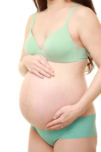 Vrouw Aanraken Van Haar Groeiende Zwangere Buik — Stockfoto