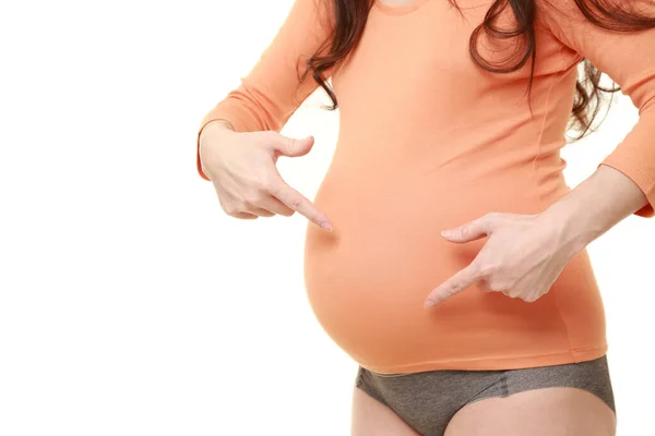 Schwangere Zeigt Auf Ihren Bauch — Stockfoto