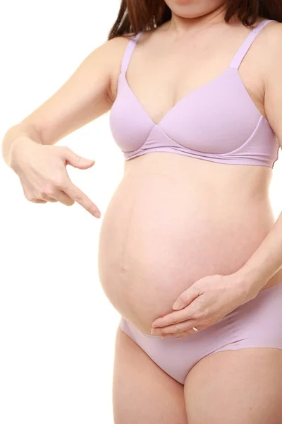 Gravid Kvinna Som Pekar Magen — Stockfoto