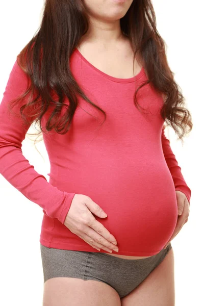 女人摸她怀孕的肚子 — 图库照片