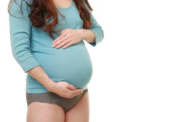 Woman Touching Her Growing Pregnant Belly — Stock Photo, Image