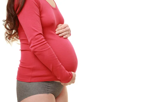 Vrouw Aanraken Van Haar Groeiende Zwangere Buik Stockfoto