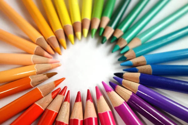 Colour pencil rainbow, isolated on white. colorful pencils in a circle. School and art supplies