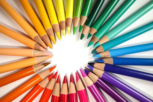 Colour pencil rainbow, isolated on white. colorful pencils in a circle. School and art supplies