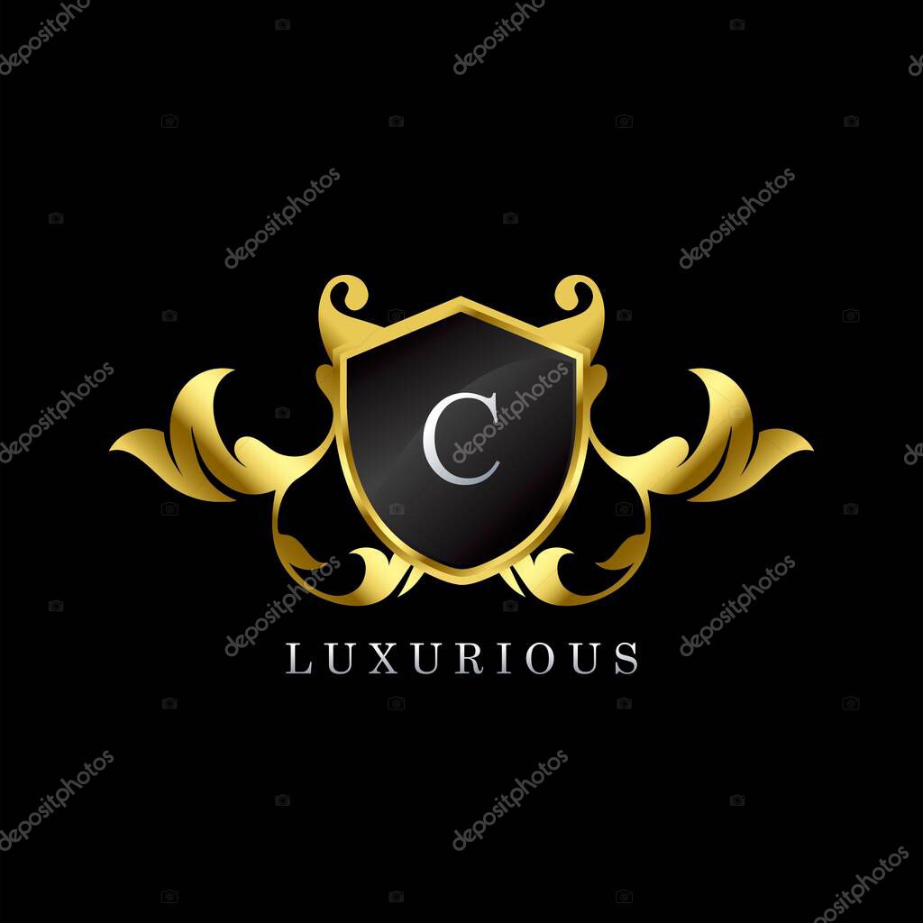 Golden Luxury Shield C Letter Logo. Elegance logo vector template made of wide silver alphabet font on shield frame ornate luxury style.