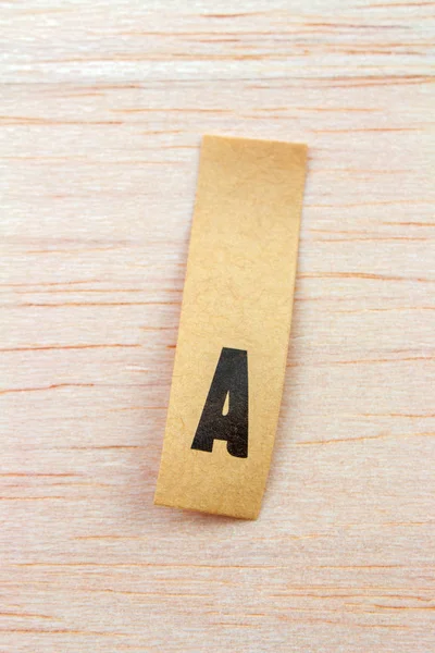 Close Shot Letter Sticker Attached Wooden Surface — Stock Photo, Image