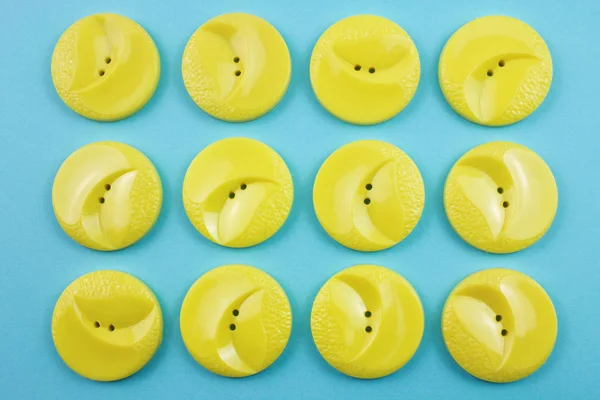 round yellow buttons on blue background