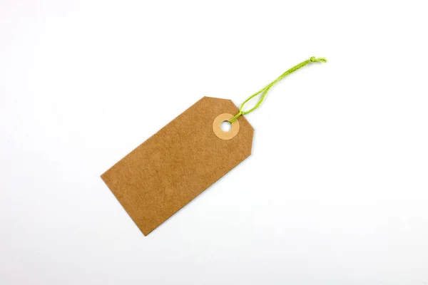 cardboard tag tied with string isolated on white