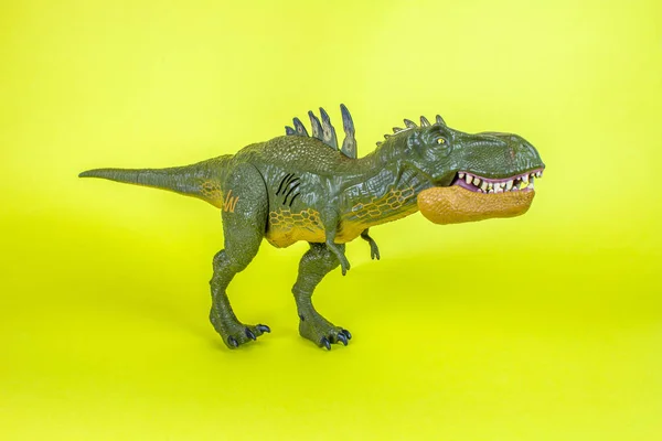 Dinosaur Plastic Toy in Yellow Background.