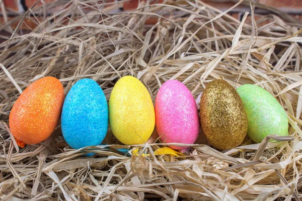 Colorful Glittered Easter Eggs in a Nest