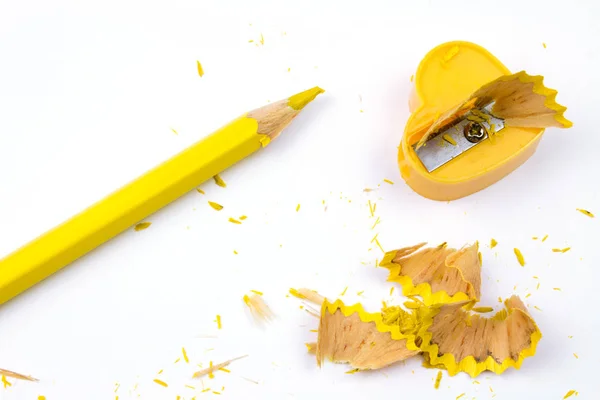 Yellow sharpener and pencil isolated on white background