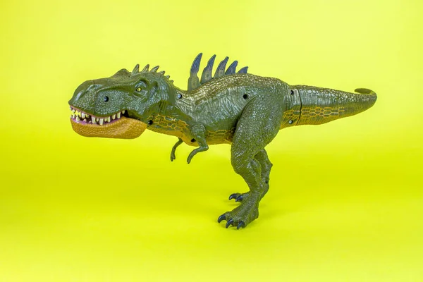 Dinosaur Plastic Toy in Yellow Background.