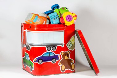 close-up shot of box full of toys on white background