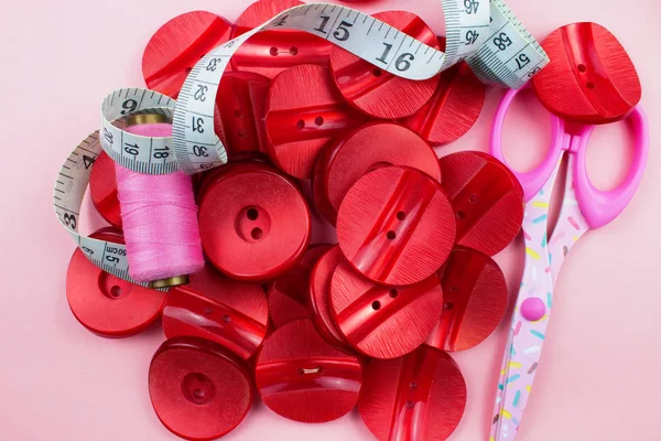 Top View Red Buttons Threads Scissors Measuring Tape Pink Background — Stock Photo, Image