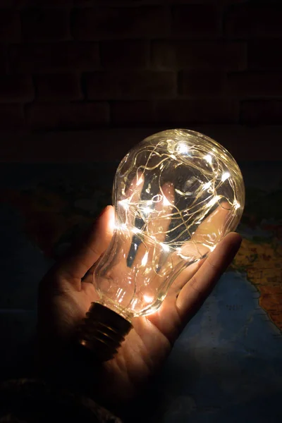 ideas light bulb on a hand
