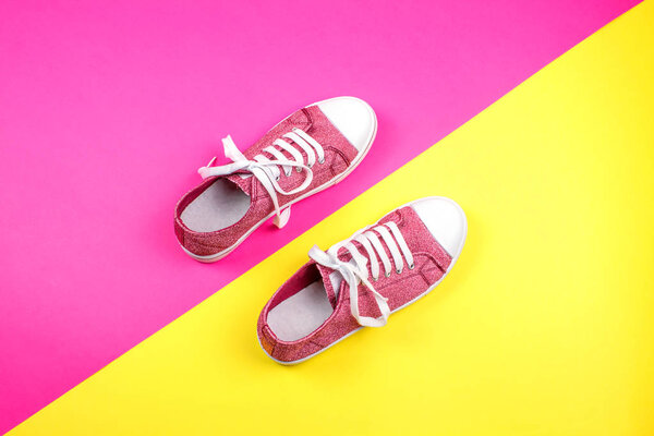 pair of vibrant sneakers on colorful background 