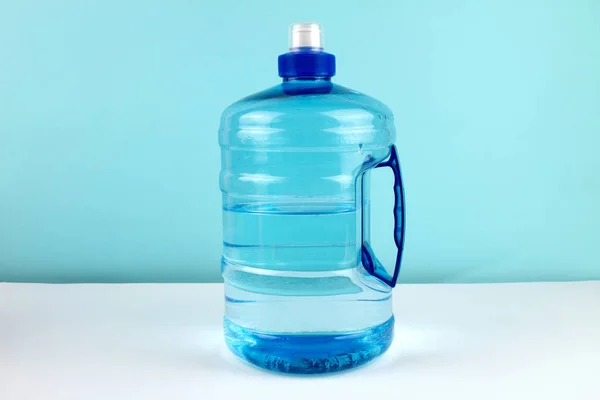 close up of sports bottle with bottle on blue