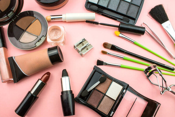 Cosmetics and Makeup Composition on Pink Background