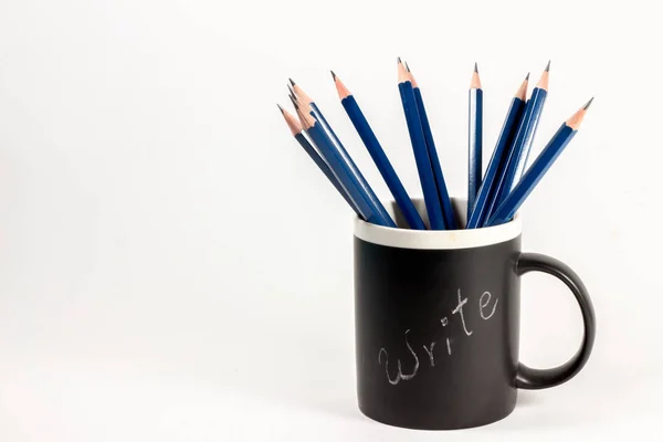 blue pencils in cup with \