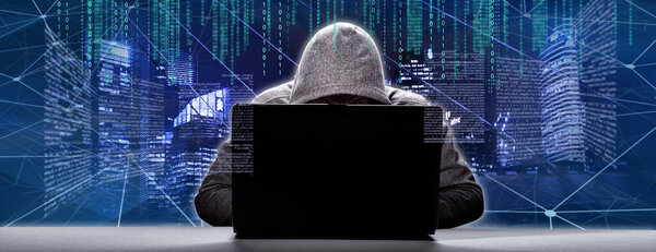 Хакер печатает код на клавиатуре ноутбука, чтобы проникнуть в киберпространство