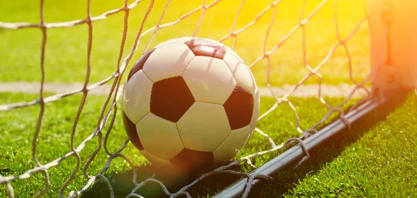 Traditional soccer game with a leather ball