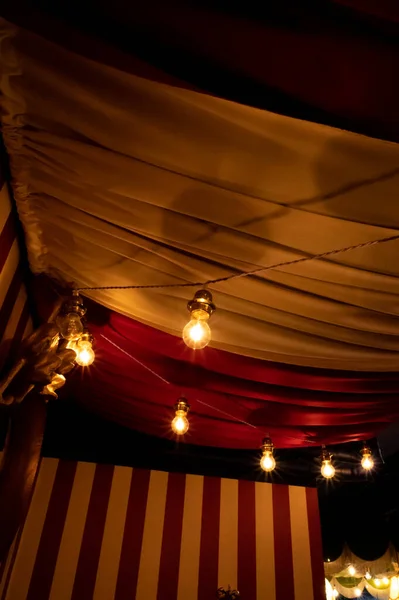 Light bulbs in a circus tent like setting