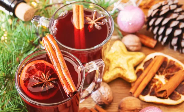 Christmas mulled wine. Merry Christmas. Glass of mulled wine with cinnamon and anise, top view. Selective focus