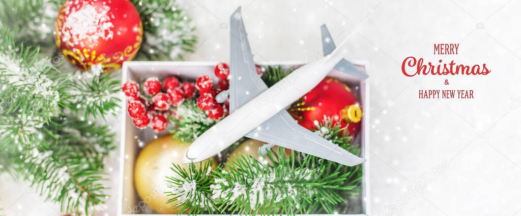 Travel for Christmas. Airplane with Christmas decor. Selective focus.Holiday