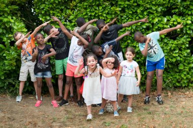 Children of emigrants. Laval. France. August 13, 2018. clipart