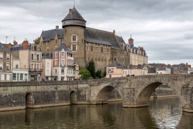 Medieval Chteau de Laval. Banks of the Mayenne river, City of Laval, Mayenne, Pays de Loire, France. August 5, 2018 clipart