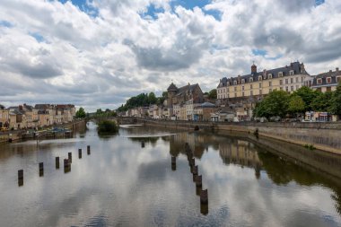 Banks of the Mayenne river, City of Laval, Mayenne, Pays de Loire, France. August 5, 2018 clipart