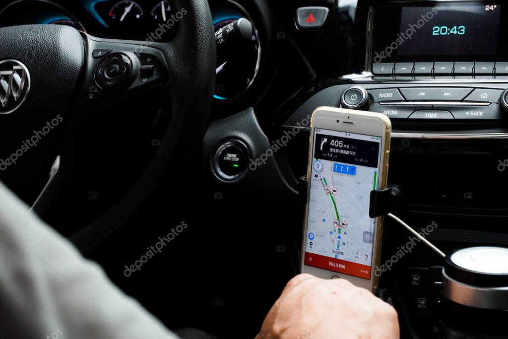 Shanghai, China - June 27, 2020: A driver following GPS direction on DiDi App. DiDi Chuxing App is major mobile car ride sharing company.