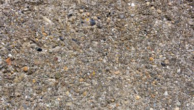  Çakıl taşlı gri dış duvarın yüzeyi.